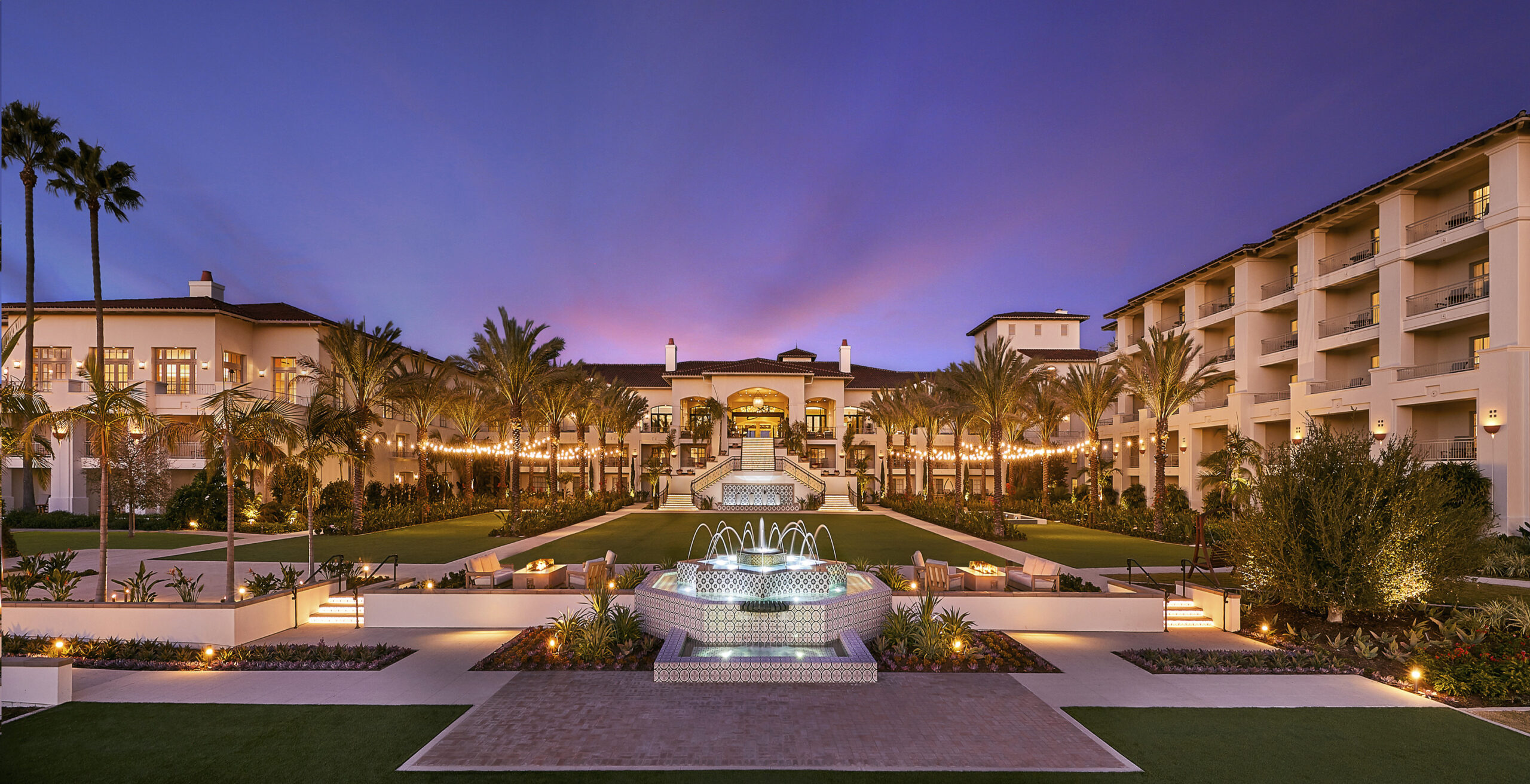 a night view of the landscape and architecture at park hyatt aviara at sunset