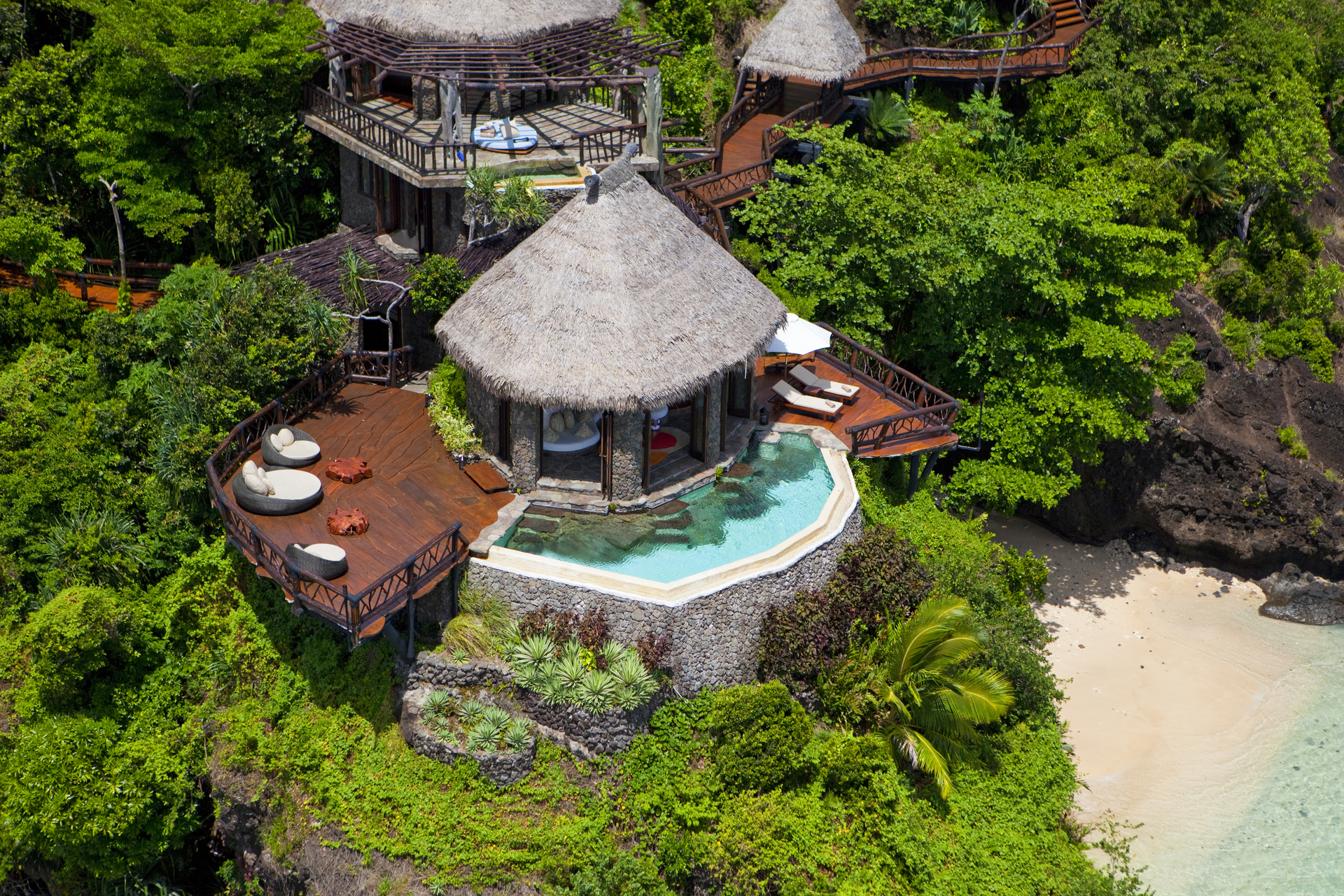 laucala island from the air, beach, palm trees and hotel resort