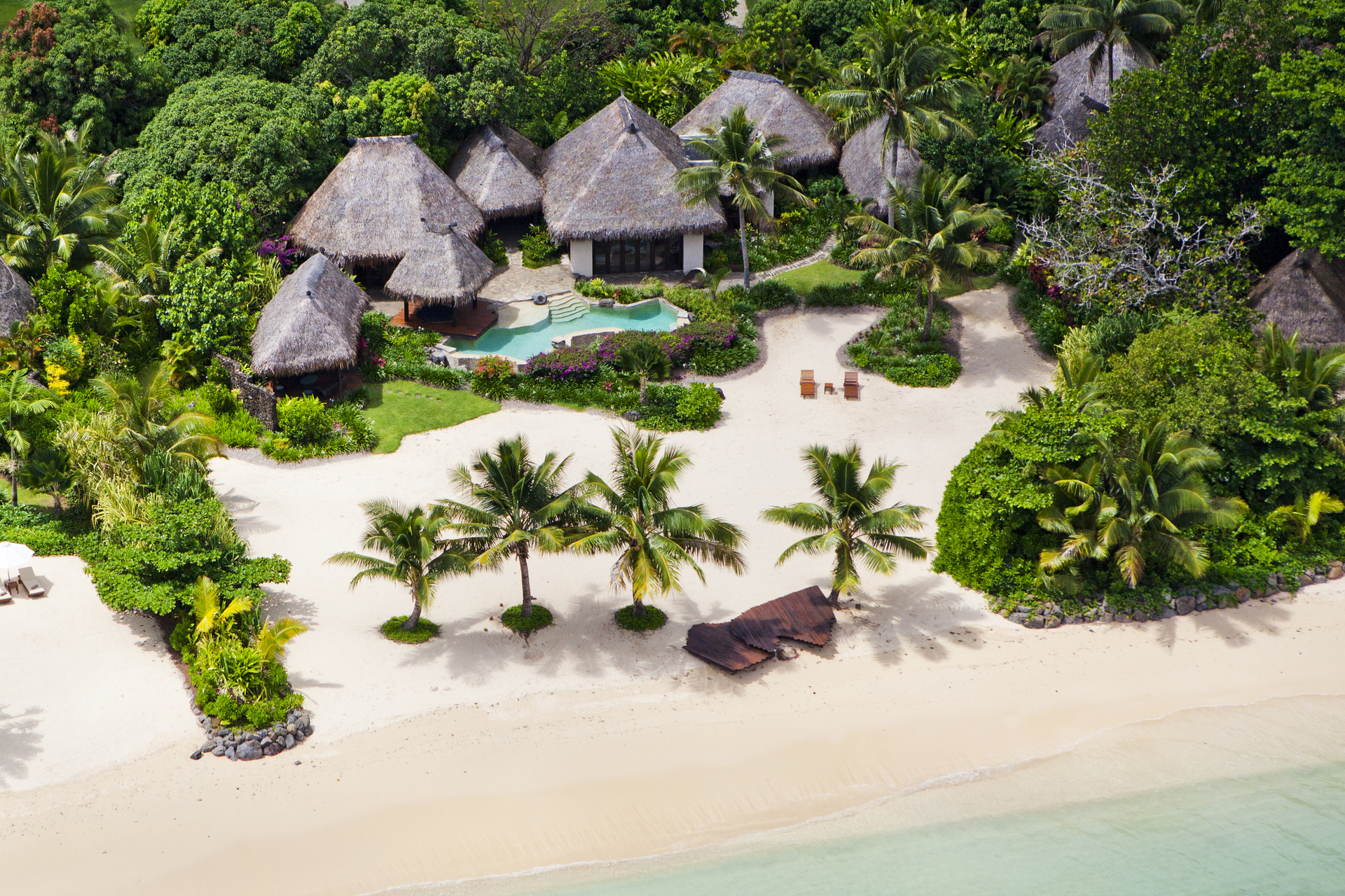 laucala island from the air, beach, palm trees and hotel resort