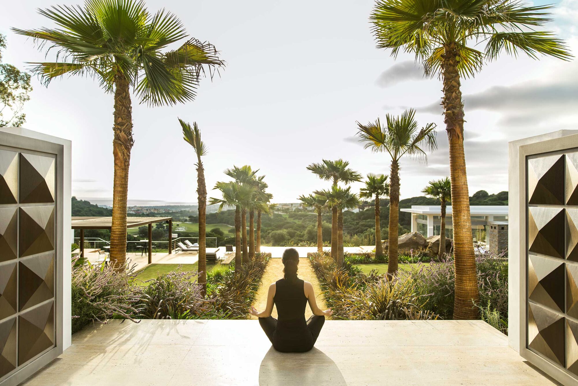 Women meditating on the balcony