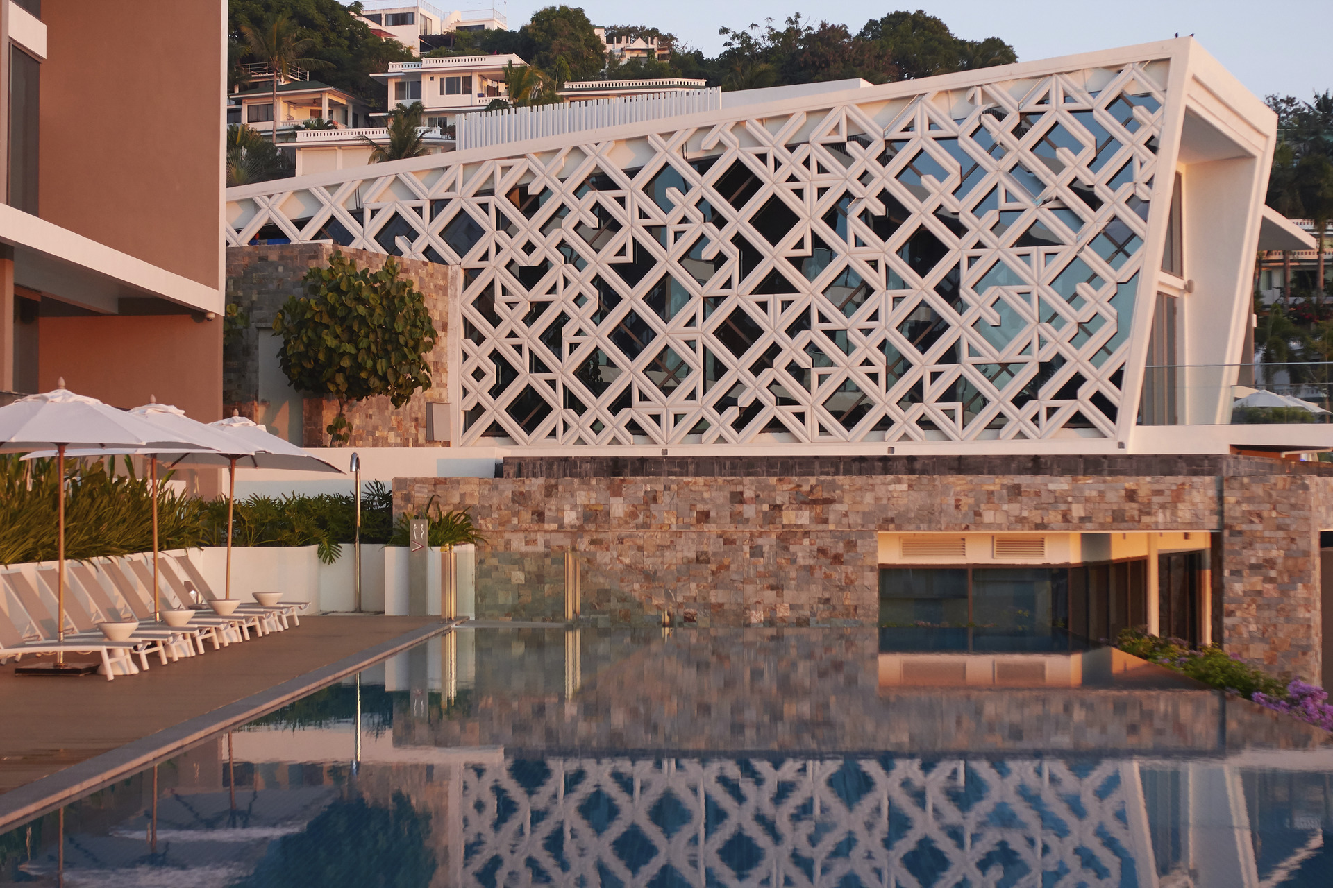 crimson resort boracay, sunset on architecture across pool