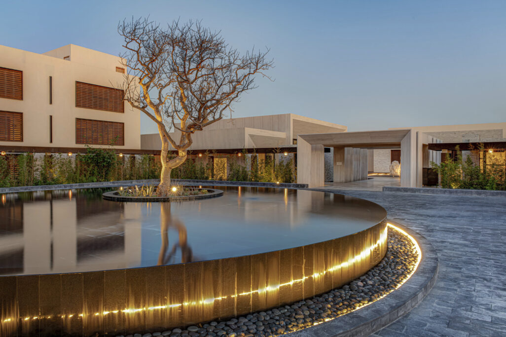 Nobu hotel los cabos architecture and landscape looking over the water feature with a tree
