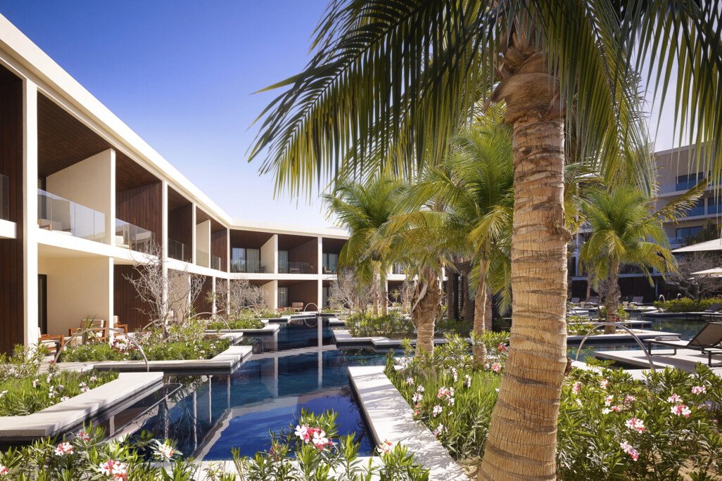 Nobu hotel los cabos architecture and landscape looking over the water feature with a tree