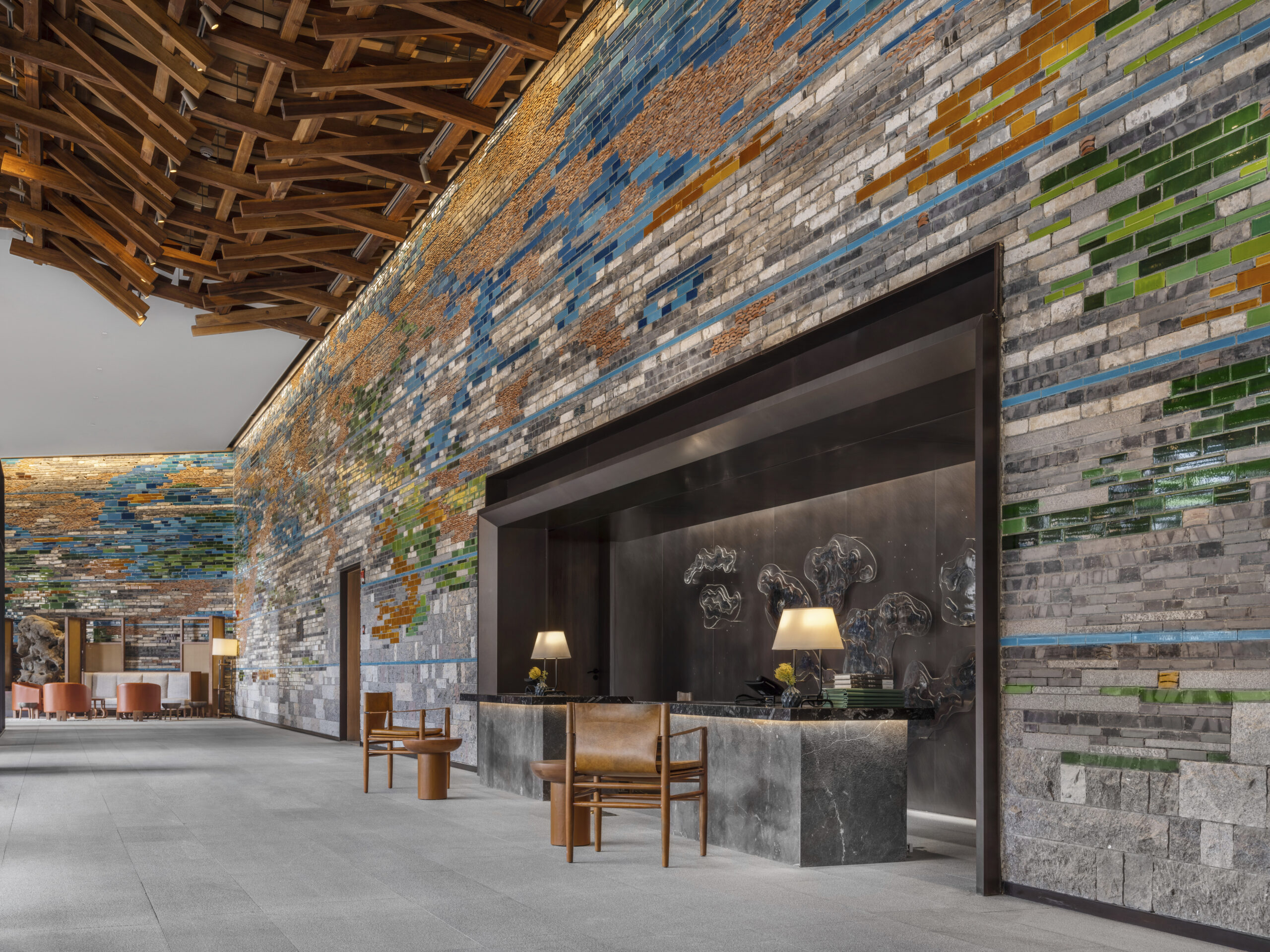 reception area at yanbai villa with a wall made from recycled tiles