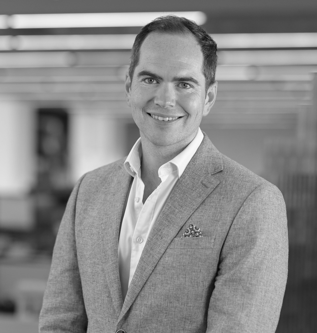 Black and white portrait of Guy Cooke, Associate Principal, Advisory Services, WATG.
