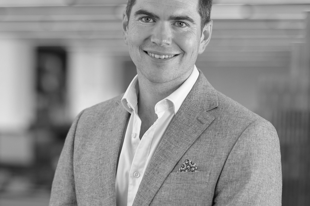 Black and white portrait of Guy Cooke, Associate Principal, Advisory Services, WATG.