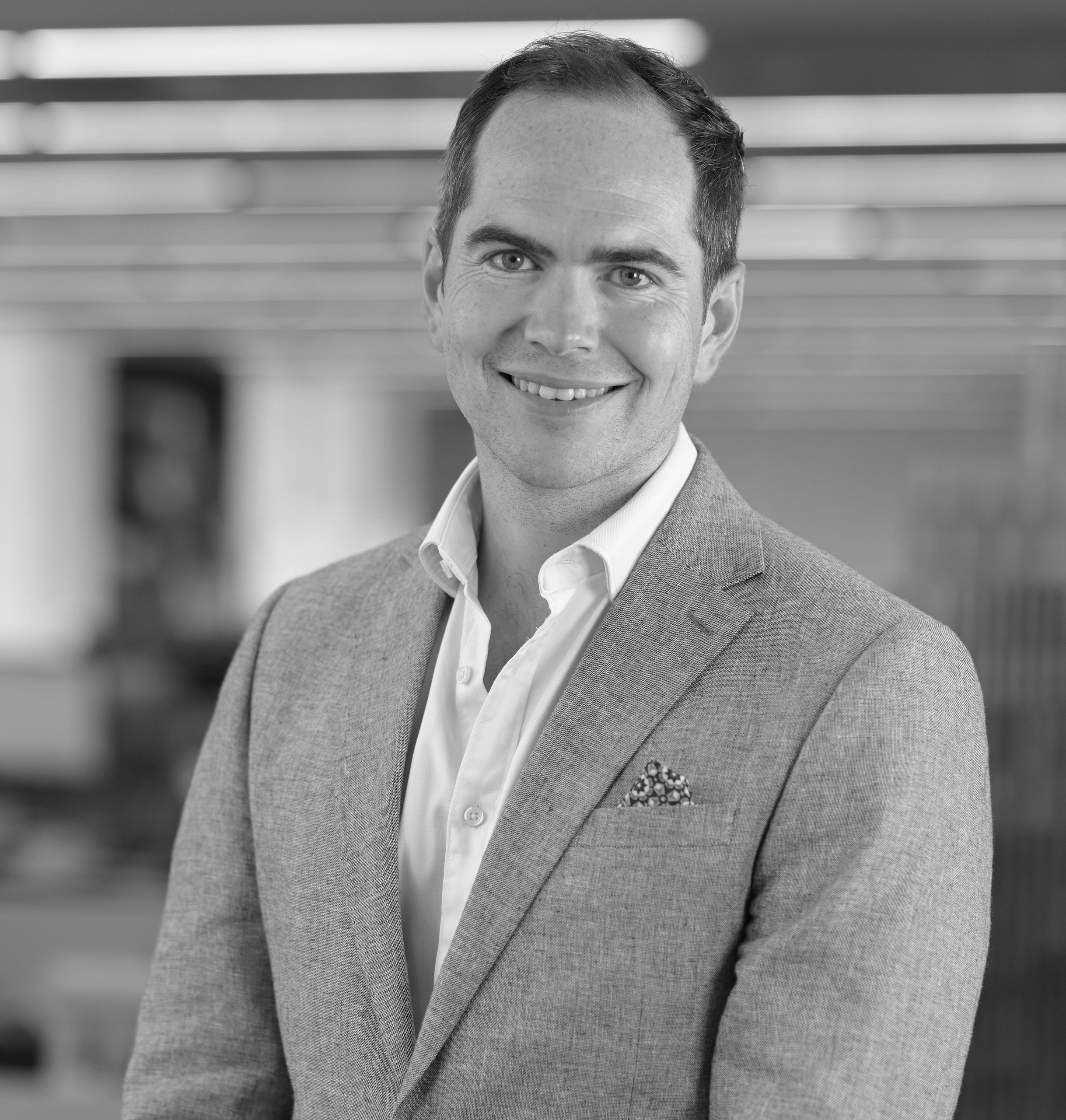Black and white portrait of Guy Cooke, Associate Principal, Advisory Services, WATG.