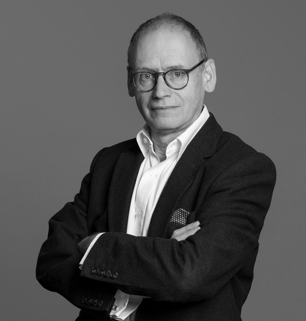 Black and white portrait of Jeremy Heyes, WATG, against a grey backdrop.