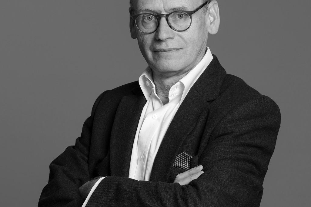 Black and white portrait of Jeremy Heyes, WATG, against a grey backdrop.