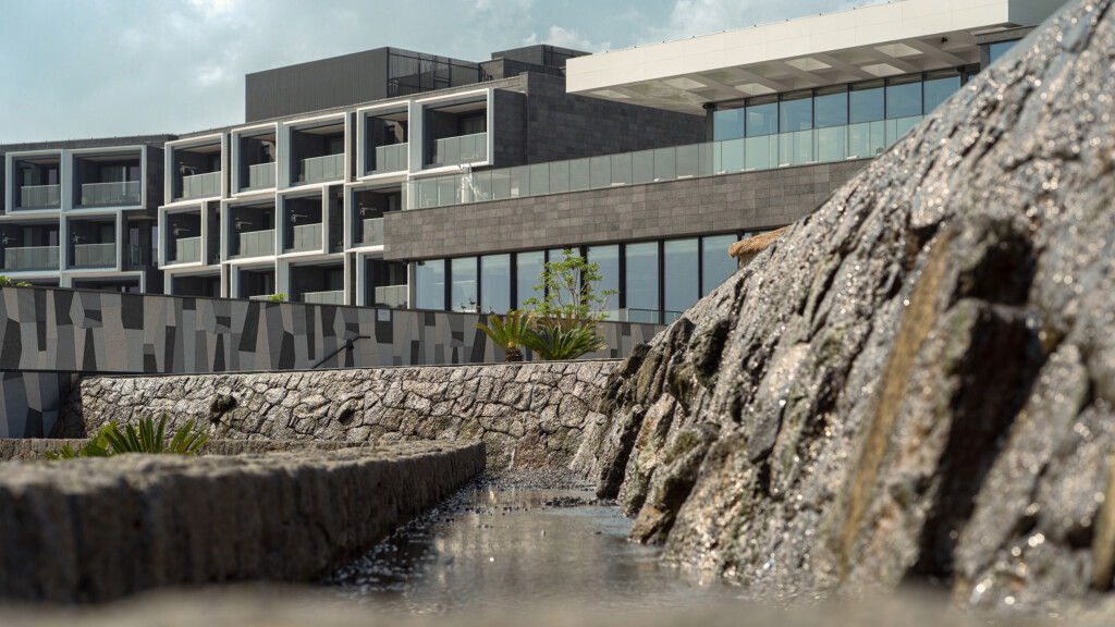 JW Marriot Jeju exterior architecture with rocks in foreground