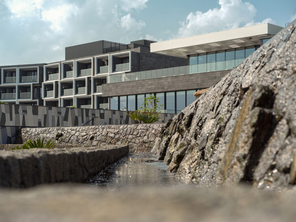 JW Marriot Jeju exterior architecture with rocks in foreground