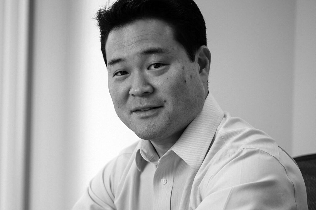 Portrait of Mark Yoshizaki in black and white