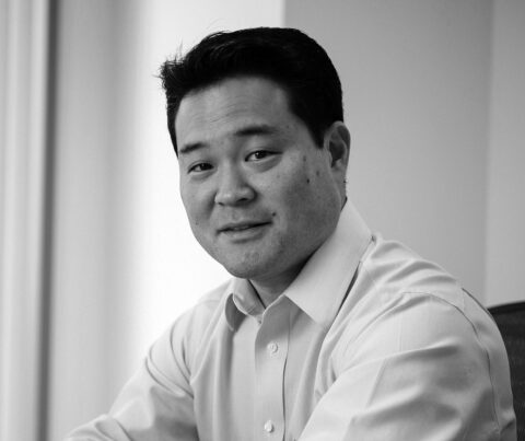 Portrait of Mark Yoshizaki in black and white