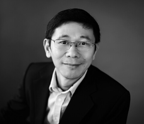 Portrait of Robert Zheng in black and white