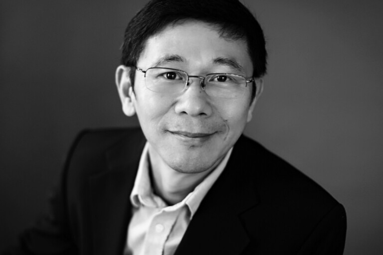 Portrait of Robert Zheng in black and white