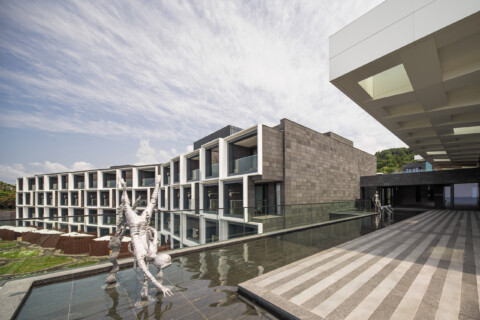 JW Marriot Jeju exterior architecture with stream and scultpure