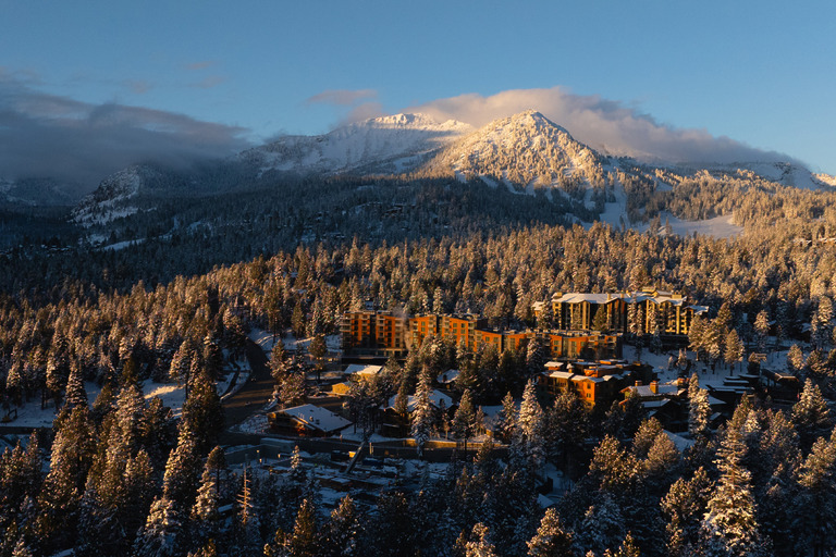Wide aerial view of Mammoth Lakes valley and surrounding mountain range in winter conditions, Limelight Hotel Mammoth Lakes by WATG