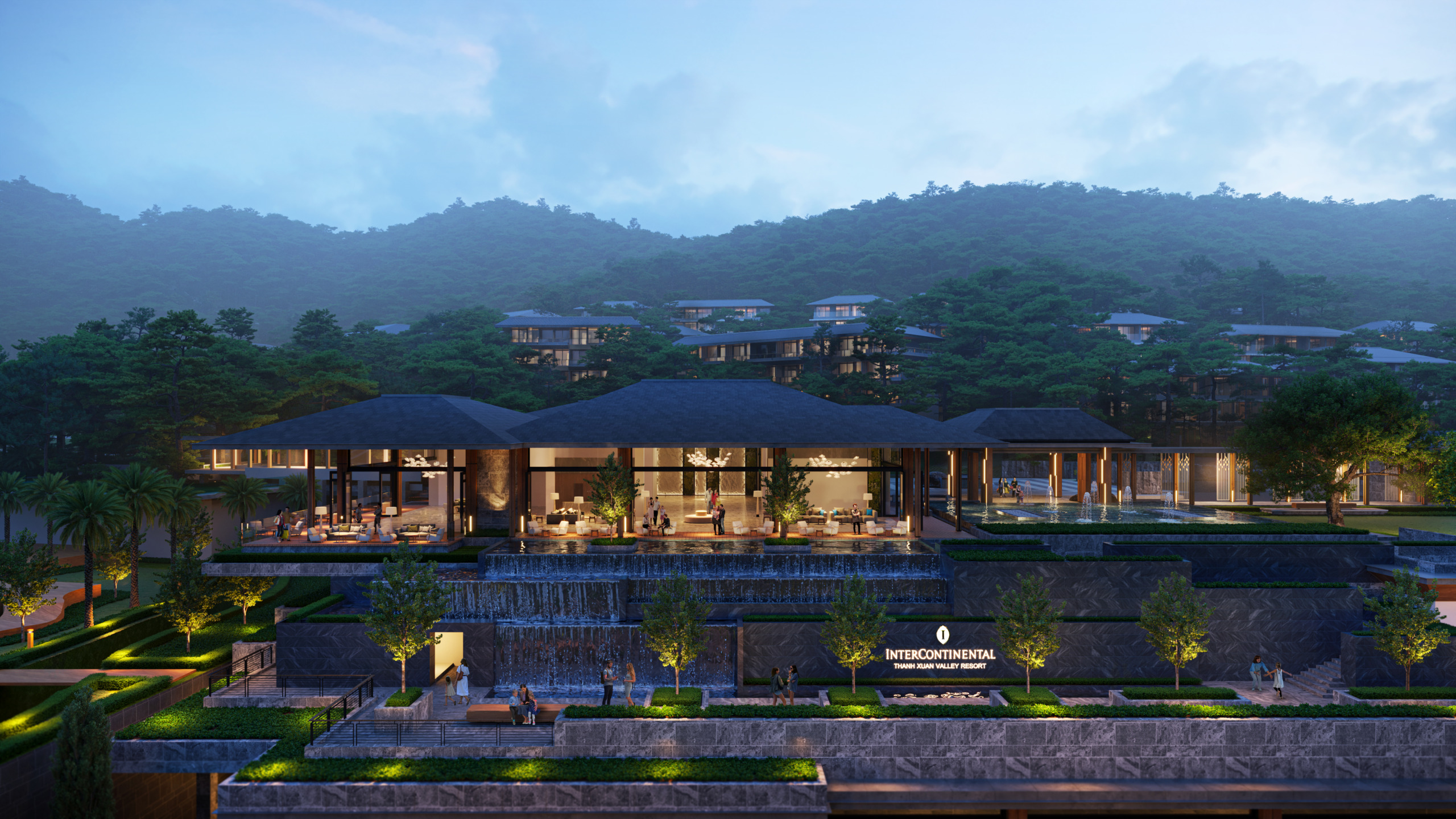 Evening render of the InterContinental Thanh Xuan Valley Resort entrance, with tiered stone terraces, cascading water features, and an open-sided pavilion lobby with a dark tiled roof set against forested mountains, residential villas visible on the slopes above.