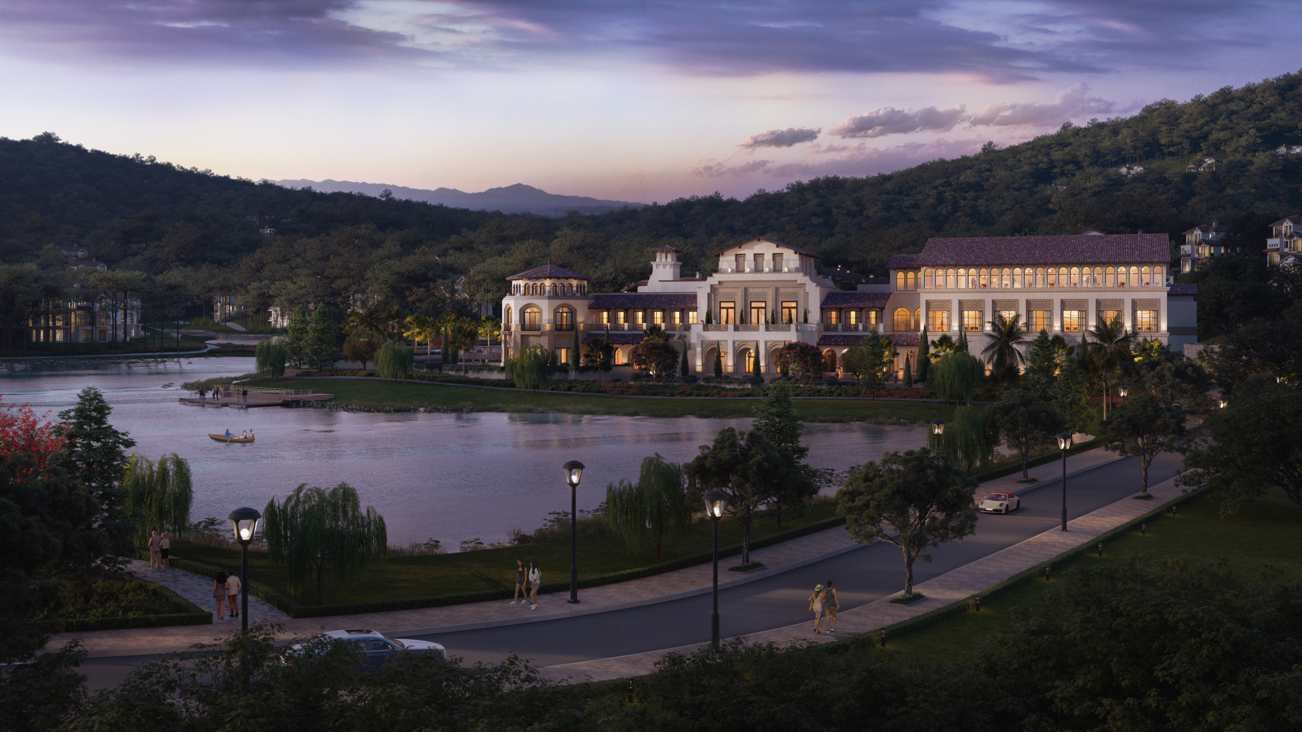 Twilight exterior render of the Country Club at Thanh Xuan Valley, a Mediterranean-style clubhouse with terracotta roofs and arched colonnades on the shore of the development's lake, with residents strolling lamplit paths and a rowboat on the water in the foreground.