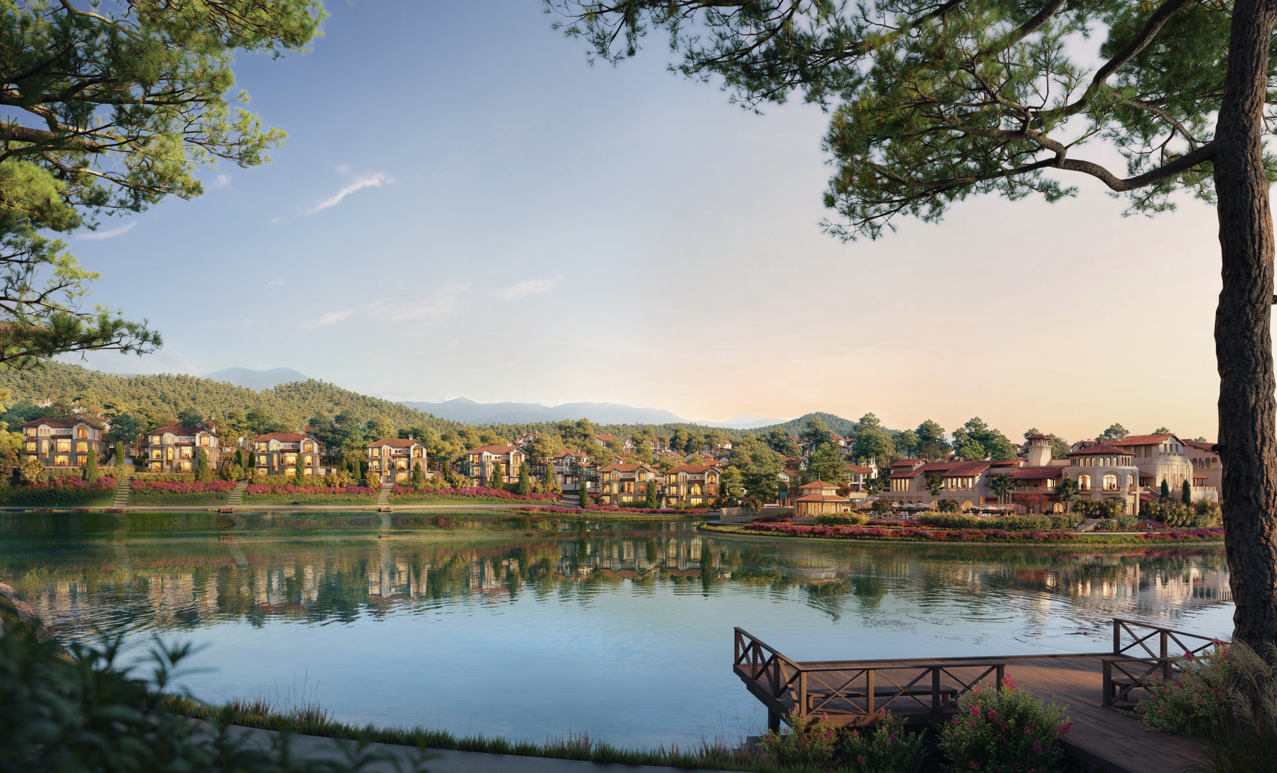 Sunset render of Thanh Xuan Valley's Mediterranean-style residential villas and Country Club reflected in the lake, with a wooden dock in the foreground and pine-forested mountains rising behind the development.