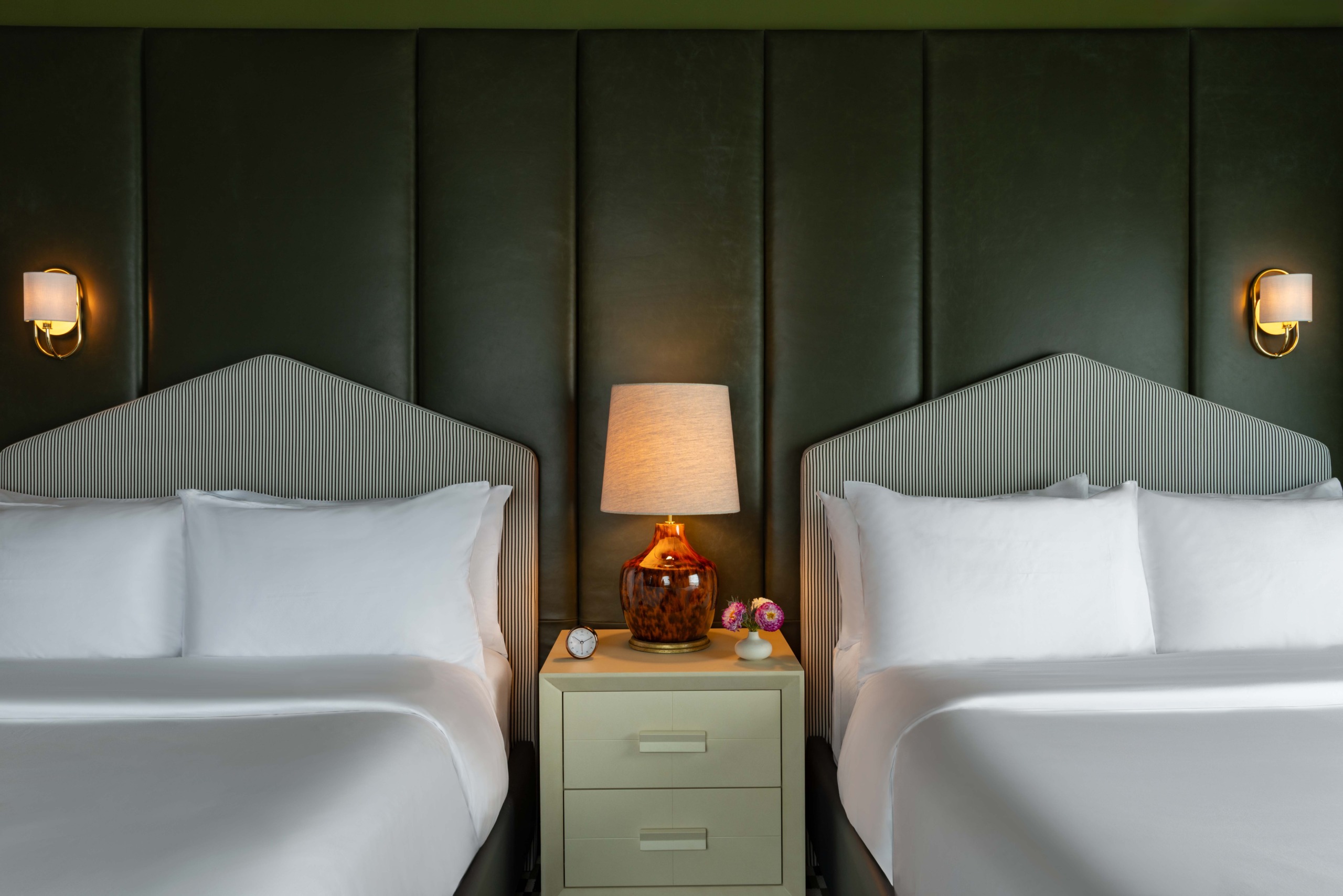 Twin beds with striped headboards and green color-drenched wall, Promenade Suite, JW Marriott Essex House.