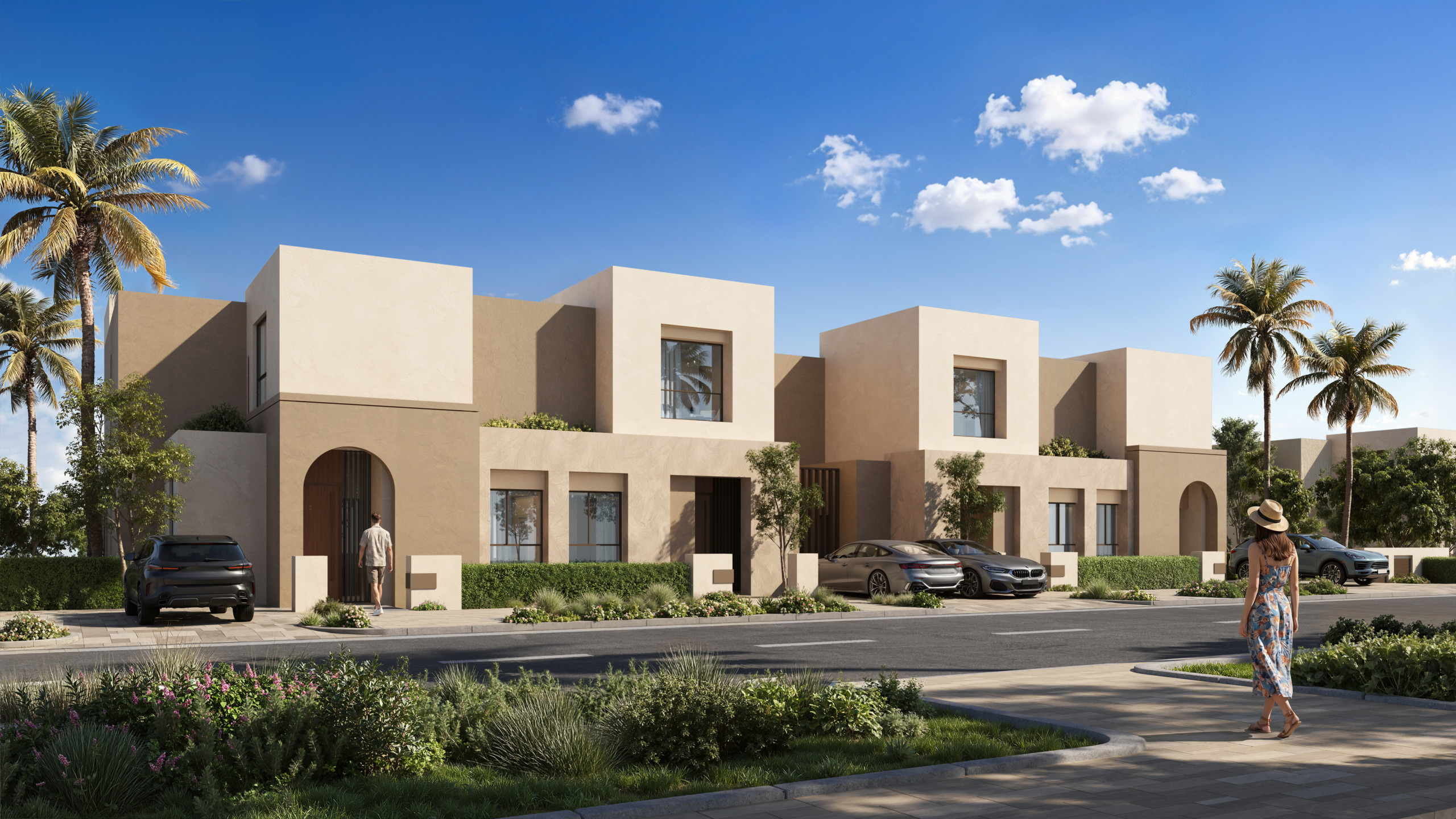 Rendering of a row of two-story townhouses at Alam Al Roum, Egypt, with stepped cubic forms, arched entrances and landscaped street.